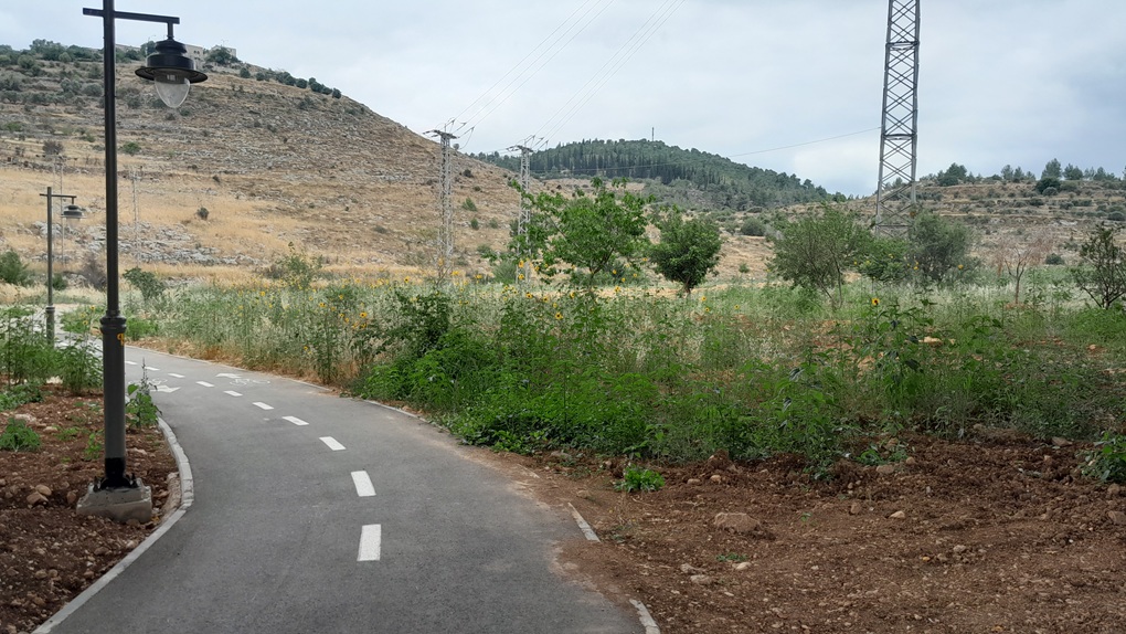 The paved Mesila bike path winding through the Jerusalem hills