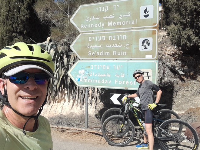 Raphi Shalom and friend at the Yad Kennedy trailhead sign